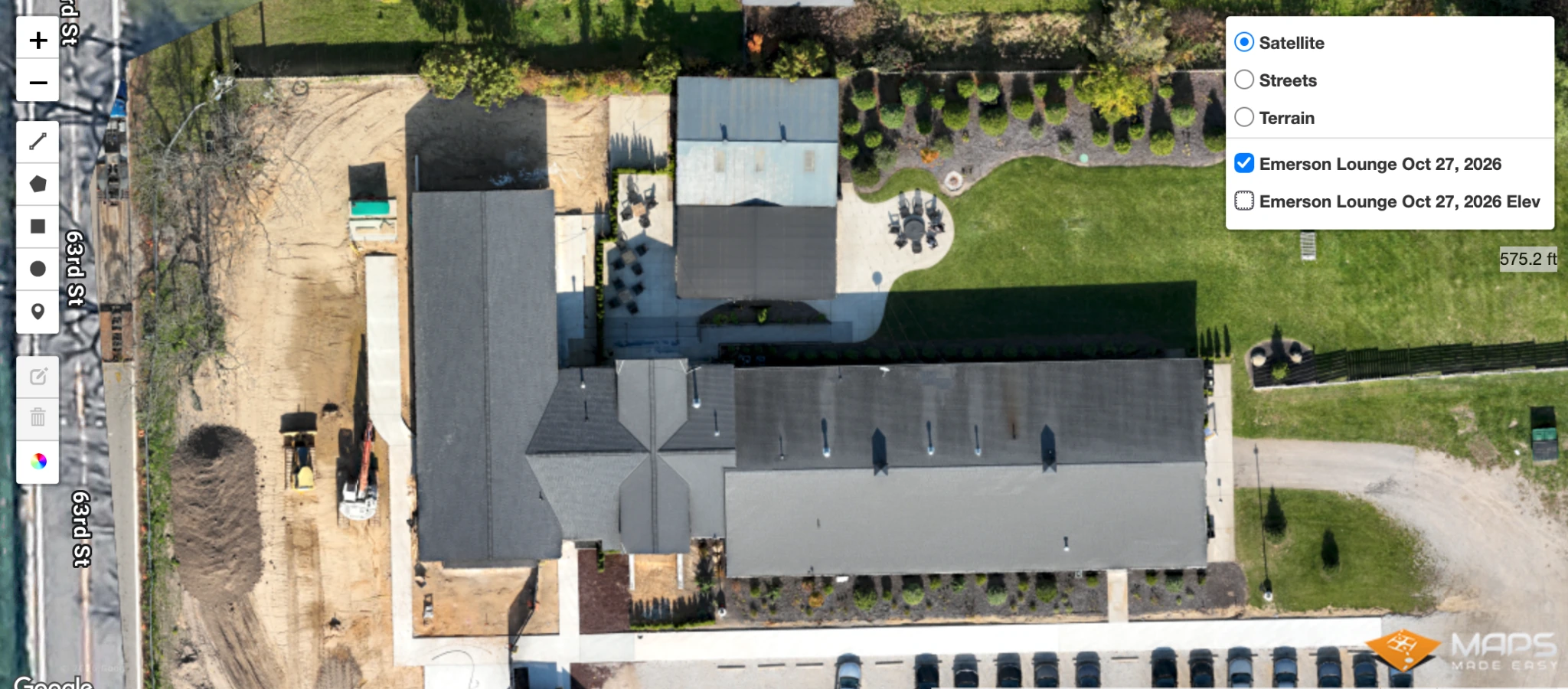 WEMAD photographic orthomosaic of Emerson Lounge showing the building roofs, courtyard, landscaping, parking, and adjacent site work on October 27, 2026